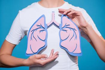 person holding cutout of the lungs |Image credit: Lightfield Studios stock.adobe.com