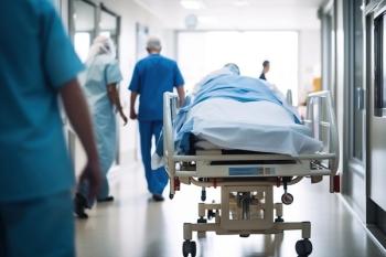hospital bed in a hospital hallway | image credit: ©adobecontributor stock.adobe.com