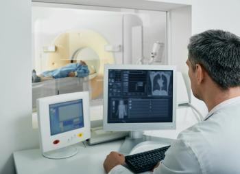 technician looking at patient getting CT scan of lungs | image credit: ©peakstock stock.adobe.com