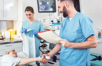Doctor monitoring patient