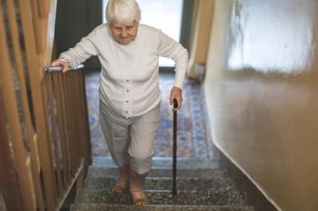 woman with a cane climbing stairs | image credit: ©Pikselstock stock.adobe.com