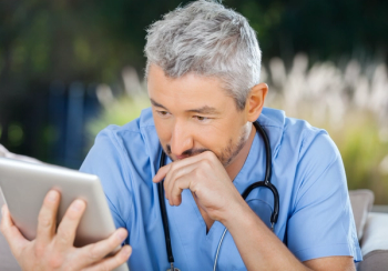 doctor looking at ipad