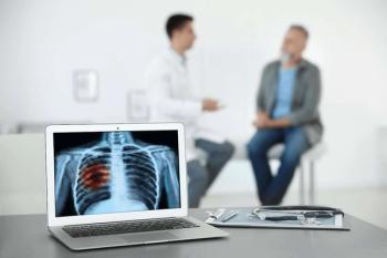 doctor talking to a patient with image of lung cancer in the foreground| ©New Africa stock.adobe.com