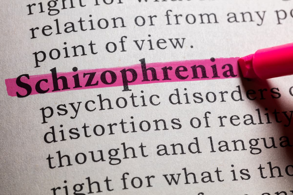 pink highlighter highlighting the word schizophrenia in the dictionary ©Feng Yu stock.adobe.com