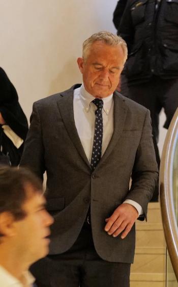 RFK Jr. looking down, going down stairs | image credit: @Renato68 stock.adobe.com