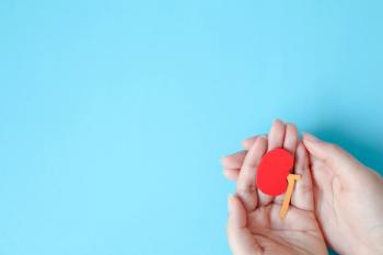 hands holding papercut of kidney | image credit: ©jajam stock.adobe.com