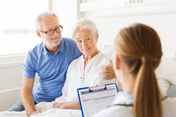 Elderly patient speaking with doctor