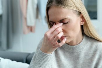 White woman wearing white sweater rubbing her eyes | ©brizmaker stock.adobe.com
