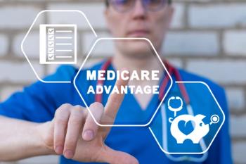 Medicare Advantage written in a hexagon with a man in scrubs pointing at it | image credit: @wladimir804 stock.adobe.com
