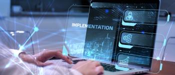 person at keyboard with the word implemetation on the screen | Image credit: ©putilov_deni stock.adobe.com