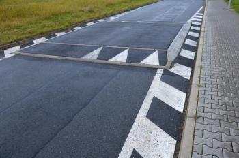 photo of a black-and-white speed bump | Image credit: © Michal stock.adobe.com