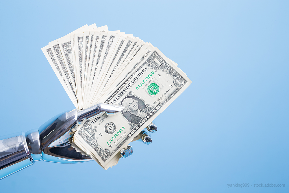 robot hand holding money