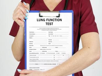 Woman holding a form that ways lung function test | Image credit: ©Yuri Kibalnik