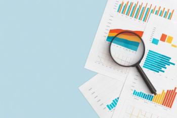 magnifying glass and charts | Image credit: Lunakate stock.adobe.com