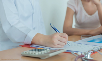 patient and doctor discussing costs