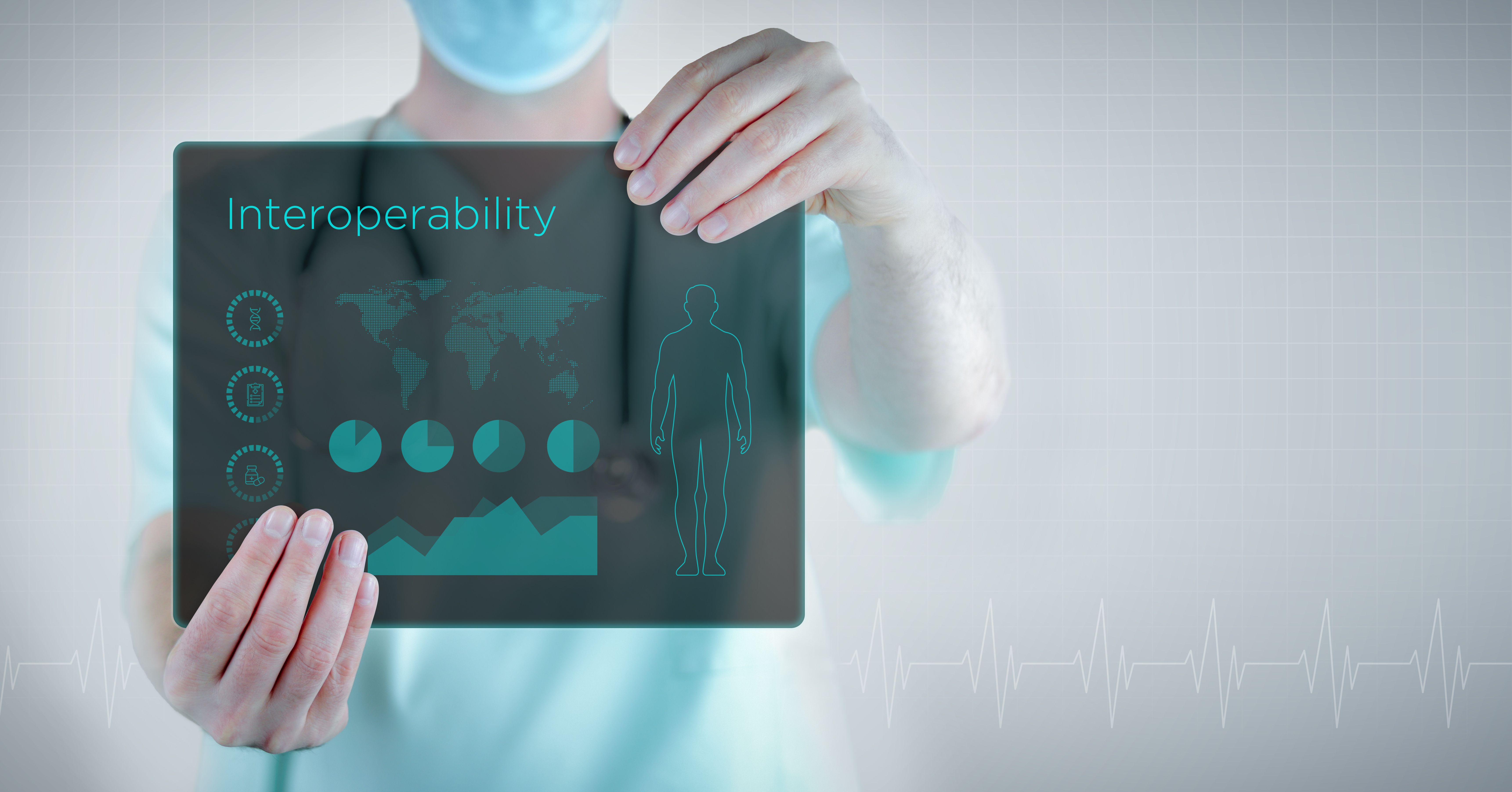 person holding sign that ways interoperability | image credit: @MQ-illustrations stock.adobe.com