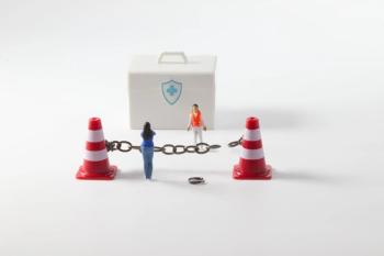 illustration of barriers to access, chain between two traffic cones with minature doll of a person | ©maria pilar martinez stock.adobe.com
