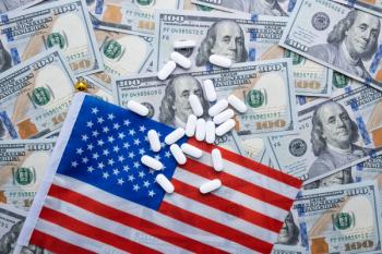 flag with pills on top and surrounded by $100 bills | ©vfhnb12