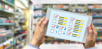 Pharmacist holding a tablet