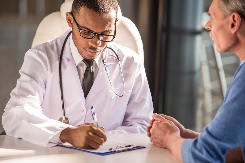 male doc with patient_VGstockstudio_shutterstock_2646924592