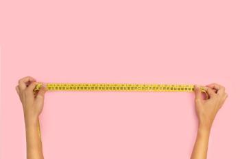 Hands holding measuring tape | Image credit: ©Mercedes Fittipaldi stock.adobe.com