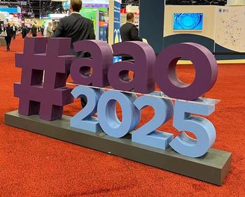 The AAO 2025 logo, in a large display on the American Academy of Ophthalmology exhibit hall floor. Photo credit: Sydney M. Crago