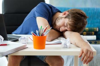 student young man asleep desk sleep school