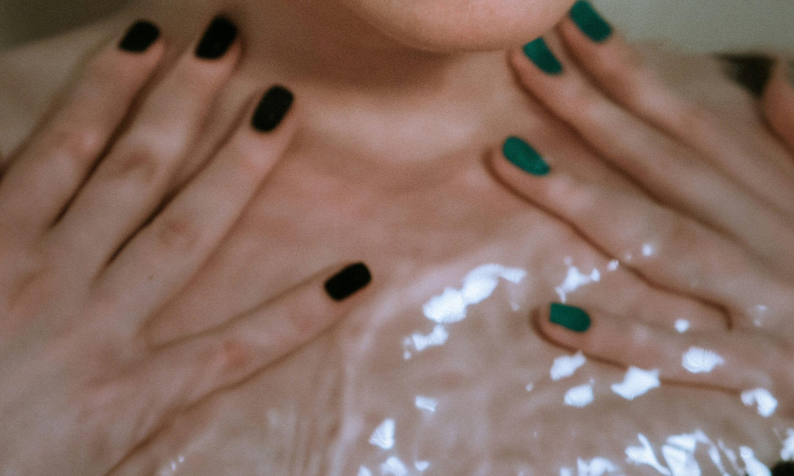 manicure with two different color nail polishes