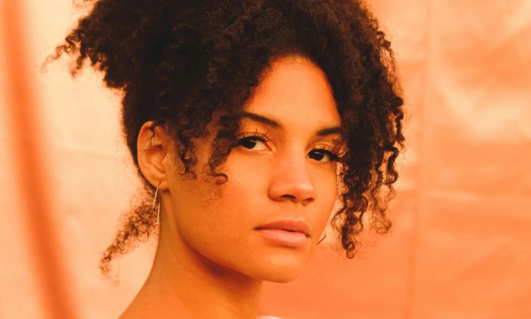 Dark-skinned woman with curly hair