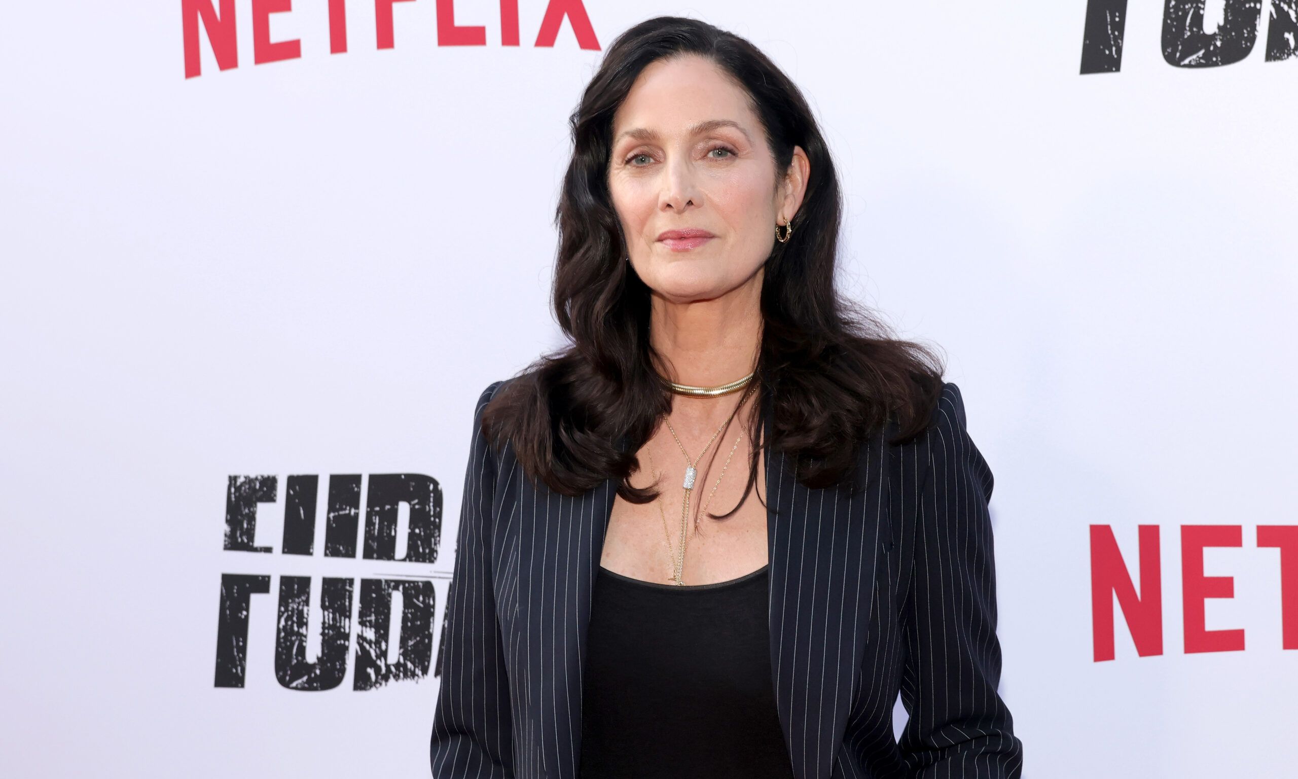 LOS ANGELES, CALIFORNIA - JUNE 11: Carrie-Anne Moss attends Netflix's "FUBAR" Season 2 Los Angeles Premiere at Netflix Tudum Theater on June 11, 2025 in Los Angeles, California.