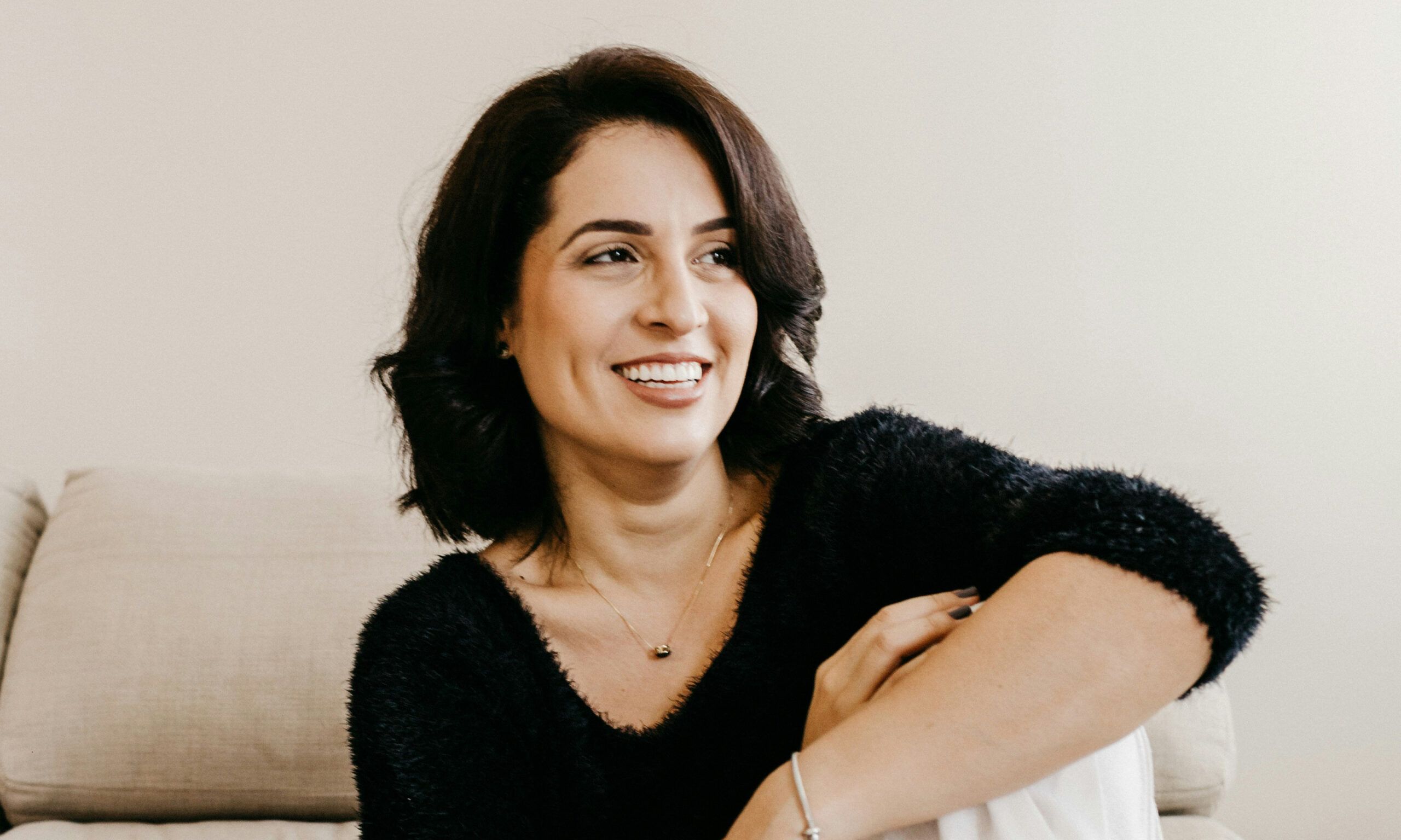 middle age woman sitting and looking to side