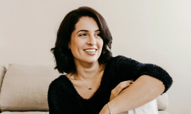 middle age woman sitting and looking to side