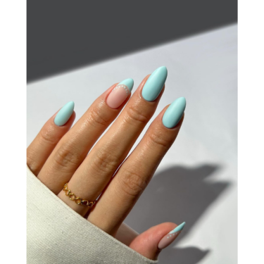 close-up of baby blue matte nails