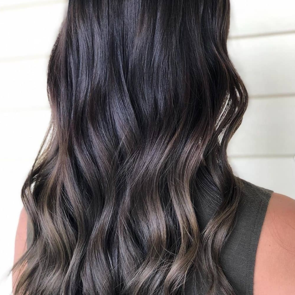 back view of wavy smokey brunette hair