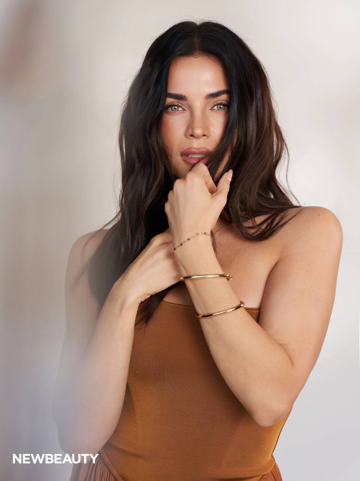 Jenna Dewan poses in a copper Zimmermann Luna Jersey Jumpsuit for NewBeauty’s May digital cover shoot.