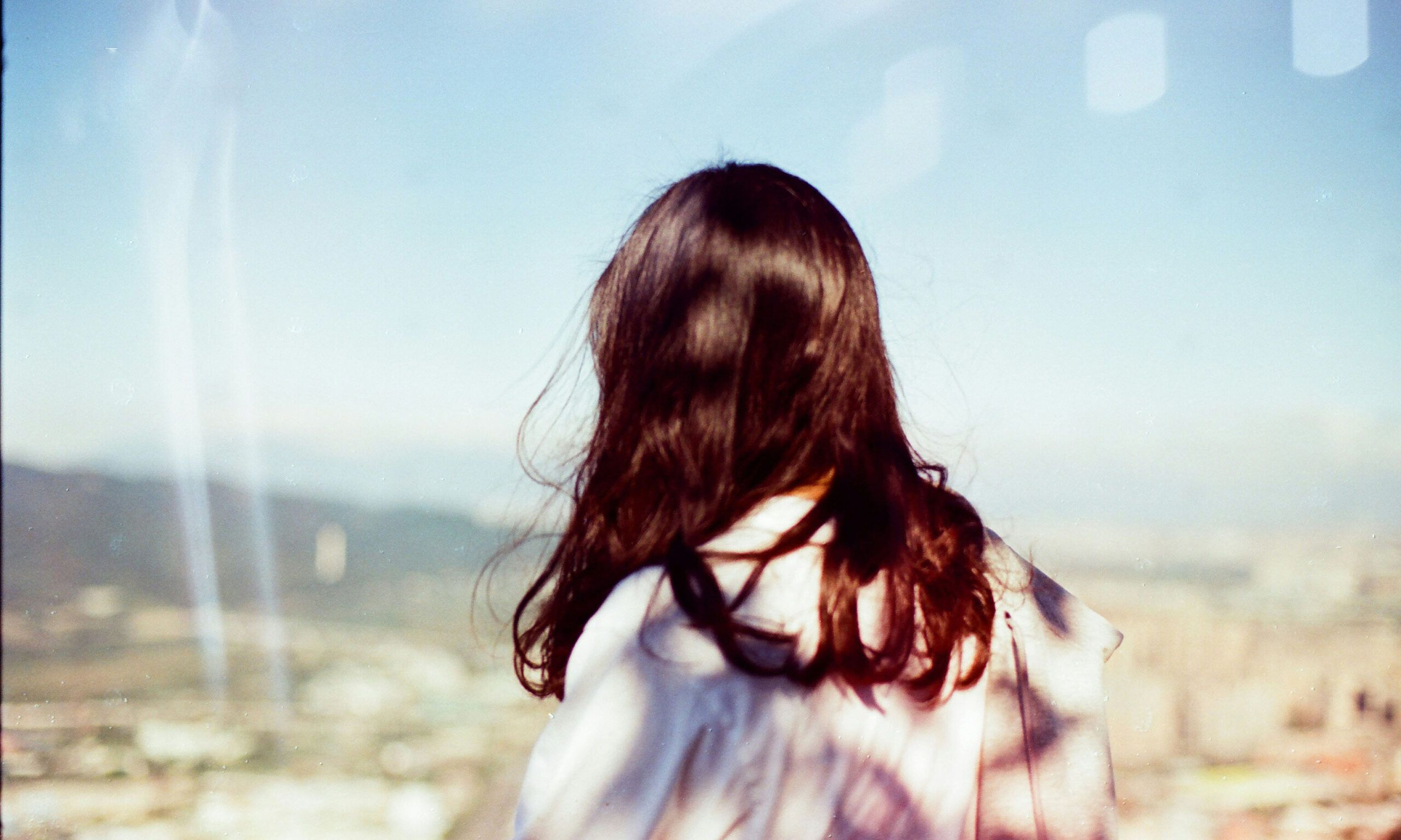 outdoor portrait of back view of woman's hair