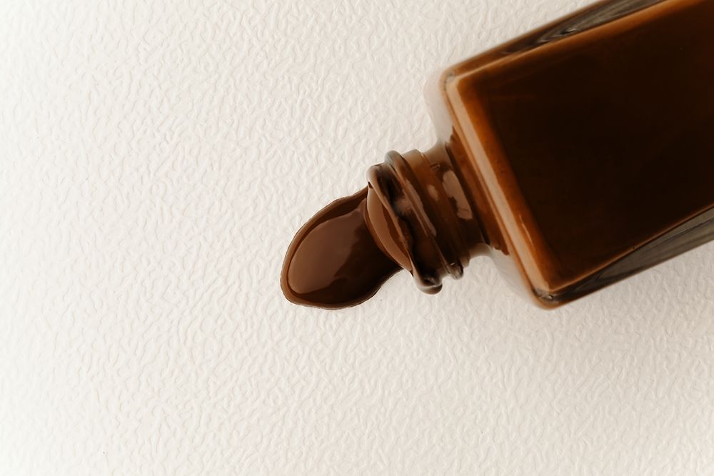 brown skin tint spilling