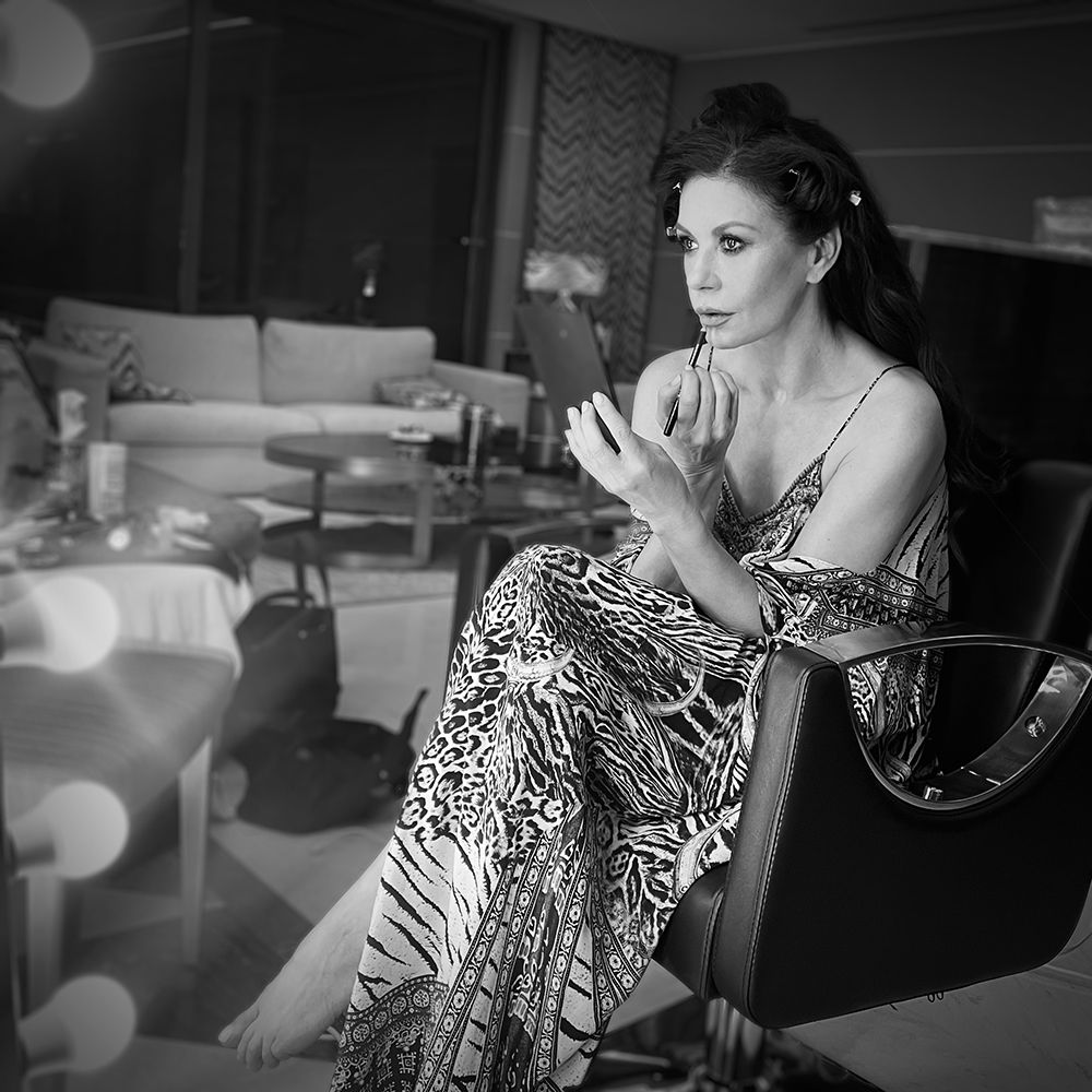 Catherine Zeta Jones putting on makeup