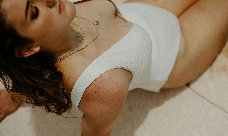 woman in white bathing suit in sun