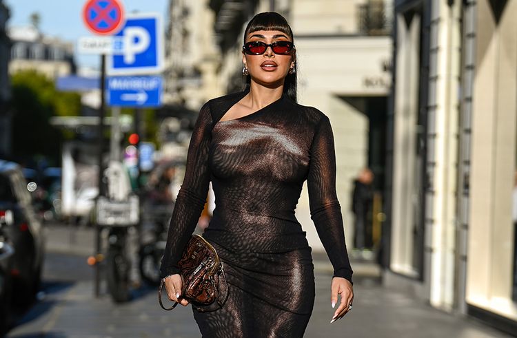 Huda Kattan is seen wearing a Jean Paul Gaultier dress, Miu Miu bag, Gentle Monster sunglasses and Maria Black earrings during the Womenswear Spring Summer 2026 as part of Paris Fashion Week on October 07, 2025 in Paris, France.