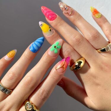 Colorful manicure with bright colors and mixed designs