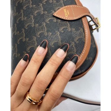 close up of black matte nail design