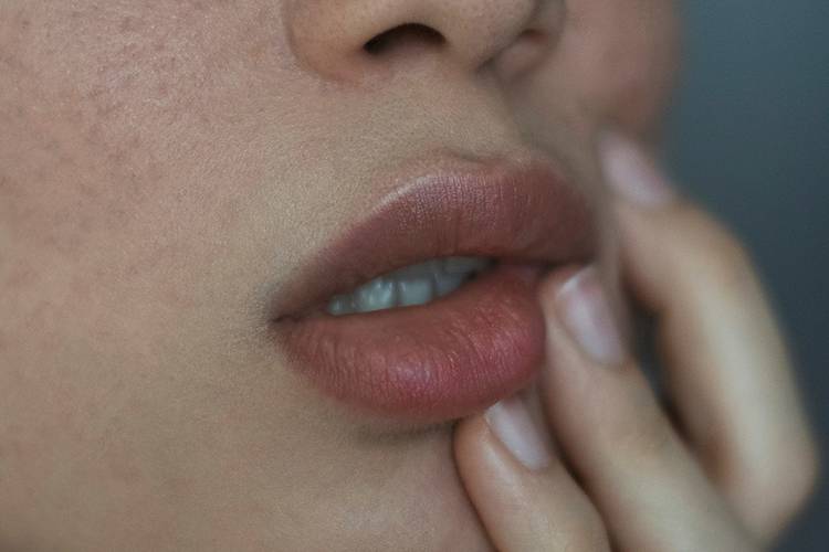 woman touching lips