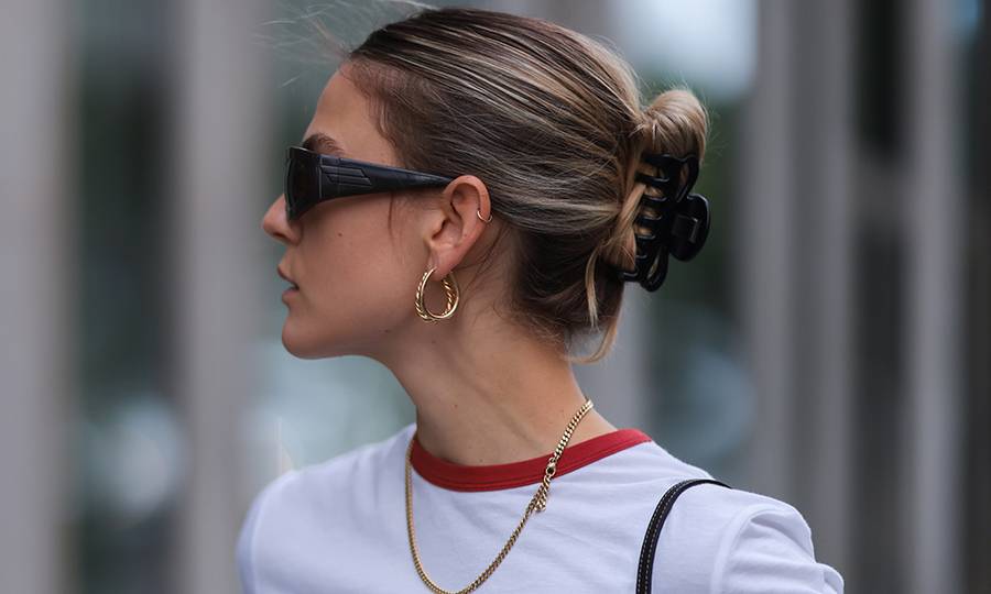 Alessa Winter wearing Bottega Veneta brown shades, Dior white shirt and Gucci vintage mini bag on August 03, 2021 in Berlin, Germany.