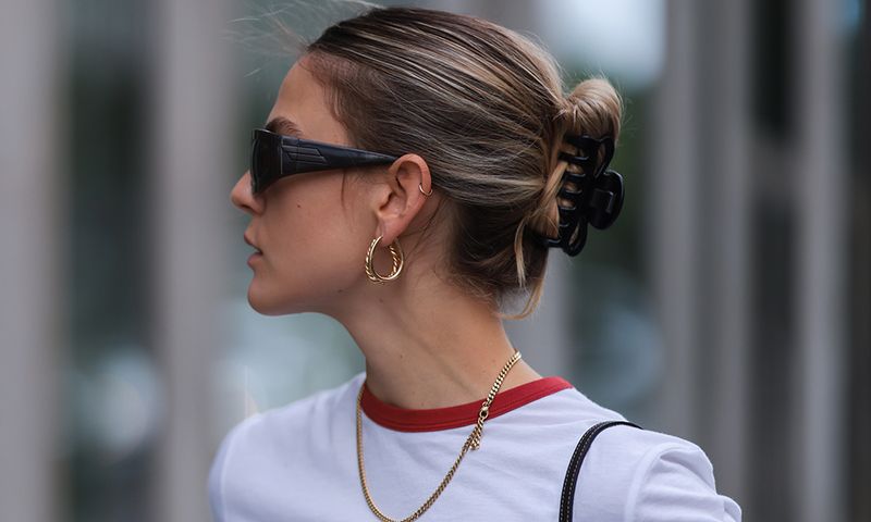 Alessa Winter wearing Bottega Veneta brown shades, Dior white shirt and Gucci vintage mini bag on August 03, 2021 in Berlin, Germany.