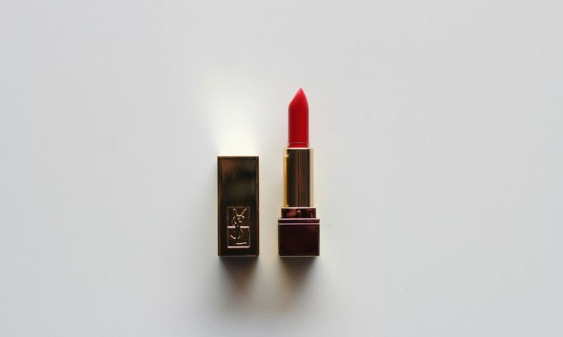 YSL red lipstick tube on gray background