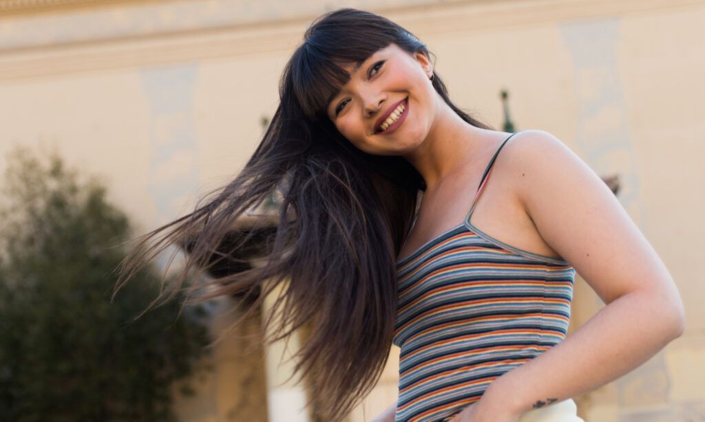 Portrait of a smiling young Eurasian woman in Barcelona