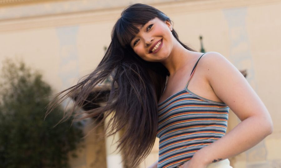 Portrait of a smiling young Eurasian woman in Barcelona