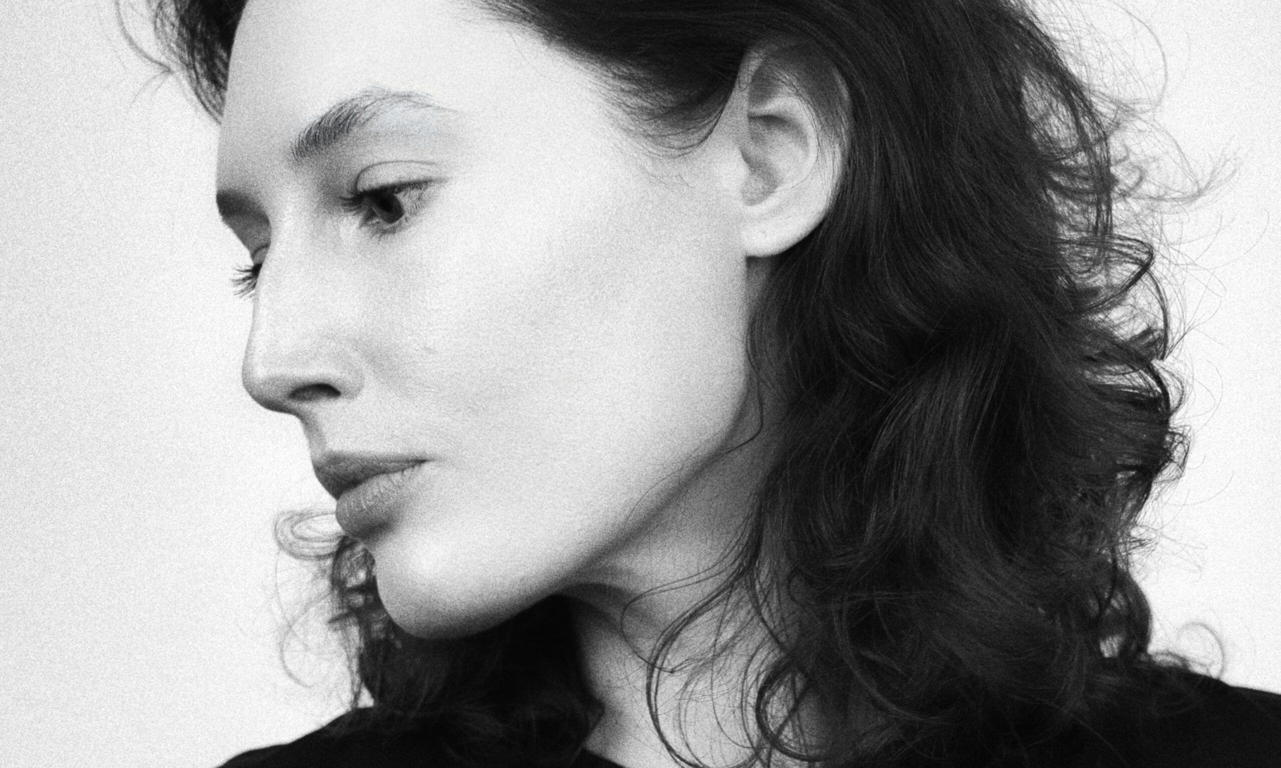 black and white photo of woman's side profile