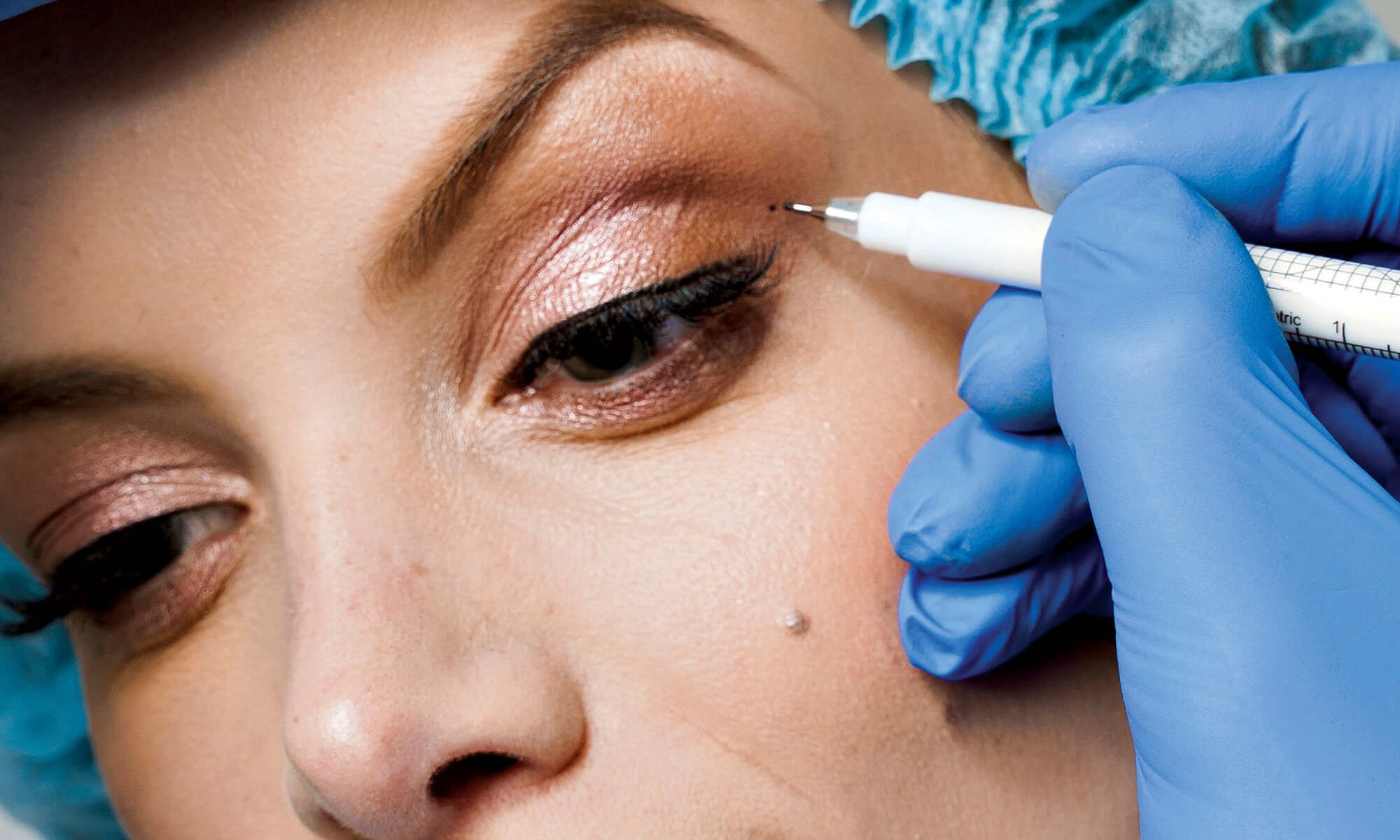 woman getting eyelift consultation